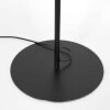 Steinhauer Lampadaire Bloeba à bras coudé orientable, abat-jour bleu, près du canapé